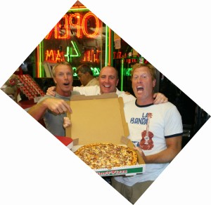 three men holding a sausage Pino's Pizza in ocean city md