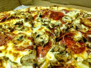 a large Pino's Pizza with mushrooms and pepperoni