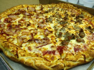 Pino's Pizza with half ham half sausage